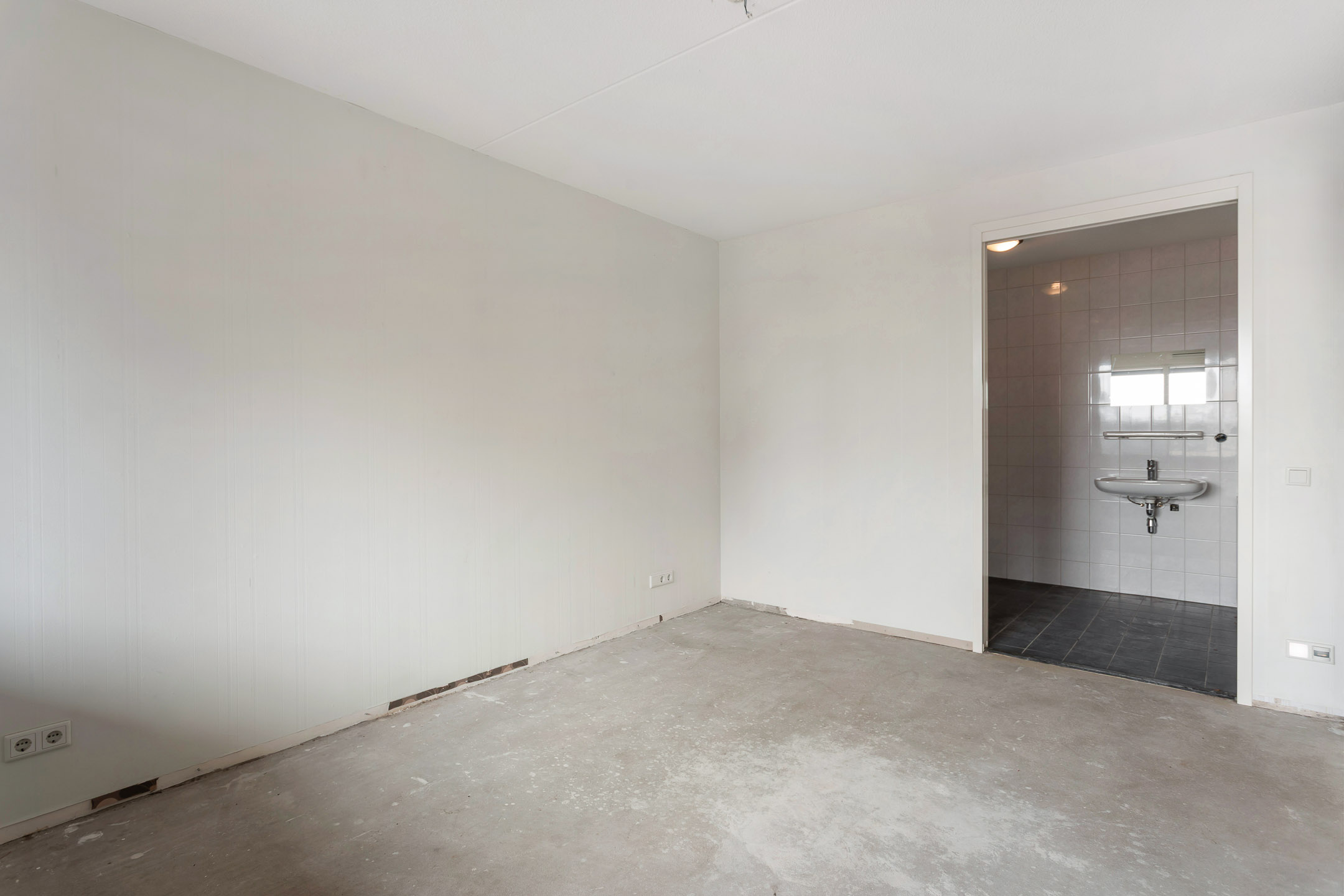 Slaapkamer met directe toegang tot toilet/douche